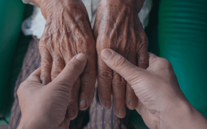 elderly woman hands - whole of life insurance